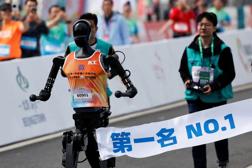 Running robots put through their paces alongside humans in Beijing half-marathon